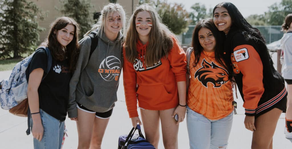 A photo of five female students from Greeley Central High School dressed in school colors.
