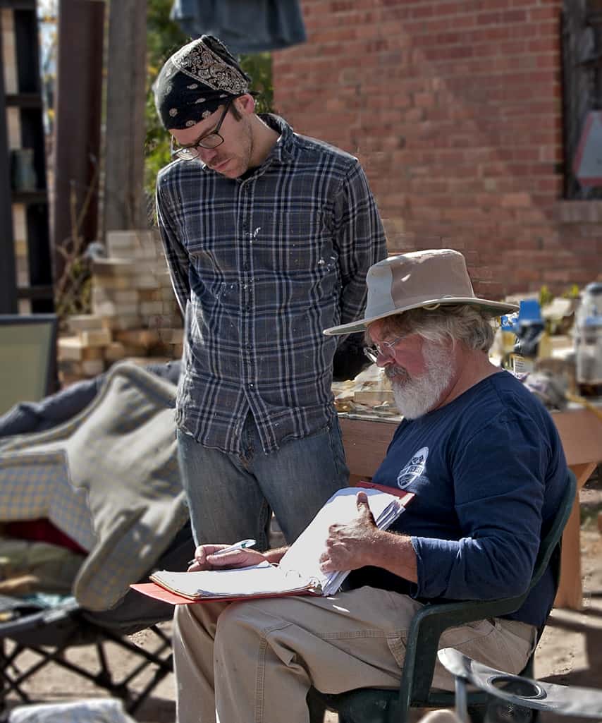 Tim Preston the founder of the clay center in Greeley works reviews sketches with Alex an artist.