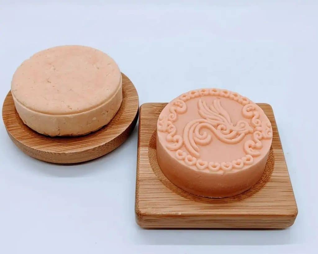 Lady at the Well handmade soap, coral colored and embossed with a bird pattern