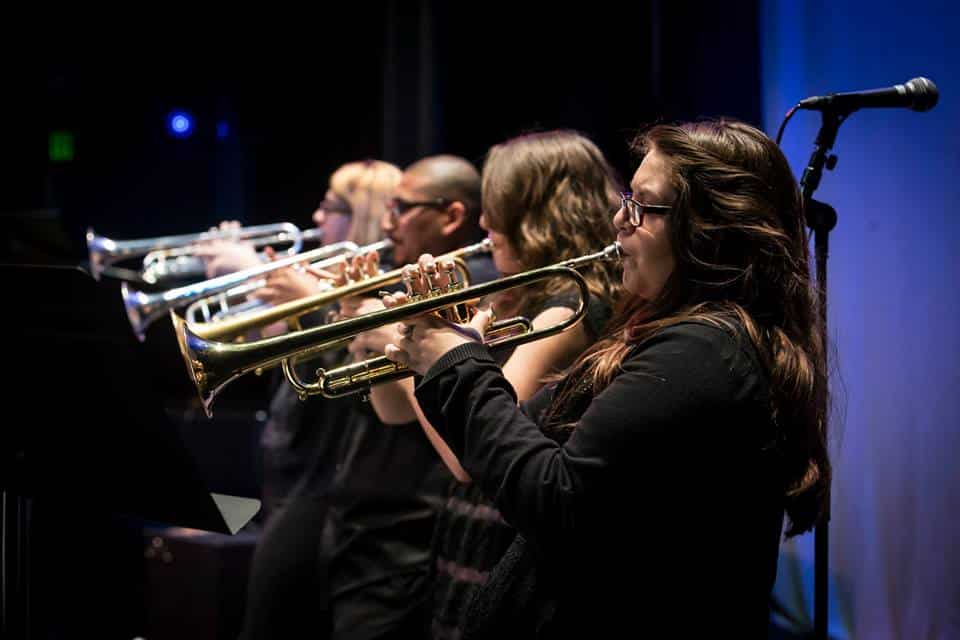 An up-close look at a row of UNC trumpet players onstage at the UNC Jazz Festival