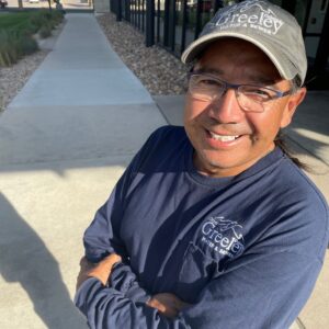 Freddy Rodriguez, City of Greeley Water employee poses outside City Center South