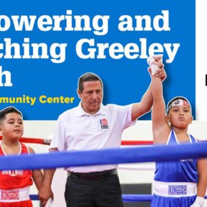 Two young boys finish a boxing match with a referee holding up the hand of the winner and text above the image says empowering and enriching Greeley Youth, Rodarte Community Center.